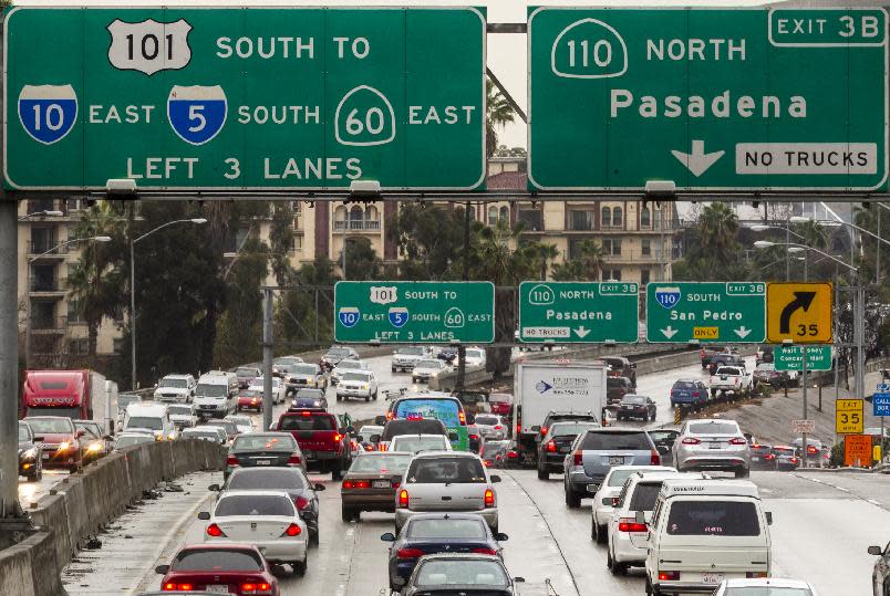 In this Thursday, Feb. 6, 2014 photo, traffic on the eastbound Hollywood Freeway, U.S. Highway 101, approaches the four-level interchange in downtown Los Angeles. A newly released report by the California Department of Transportation (CalTrans) ranks Interstate 5 in Los Angeles County as the most congested highway in the state, with other county freeways such as the 60, I-10, I-405 and 101 high on the list. In fact, Los Angeles County had the four most congested freeways (and six of the Top 10). The only counties that come close were Orange and Alameda, with two each. (AP Photo/Damian Dovarganes)