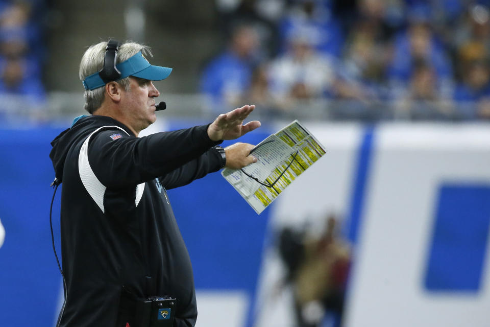 Jacksonville Jaguars head coach Doug Pederson signals from the sideline during the first half of an NFL football game against the Detroit Lions, Sunday, Dec. 4, 2022, in Detroit. (AP Photo/Duane Burleson)