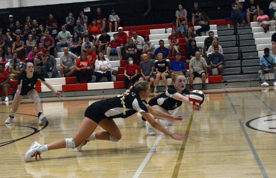 North Hagerstown's Emily Gasaway, left, and Baylee Doolan dive to try to make a dig during a Washington County volleyball match against Smithsburg.