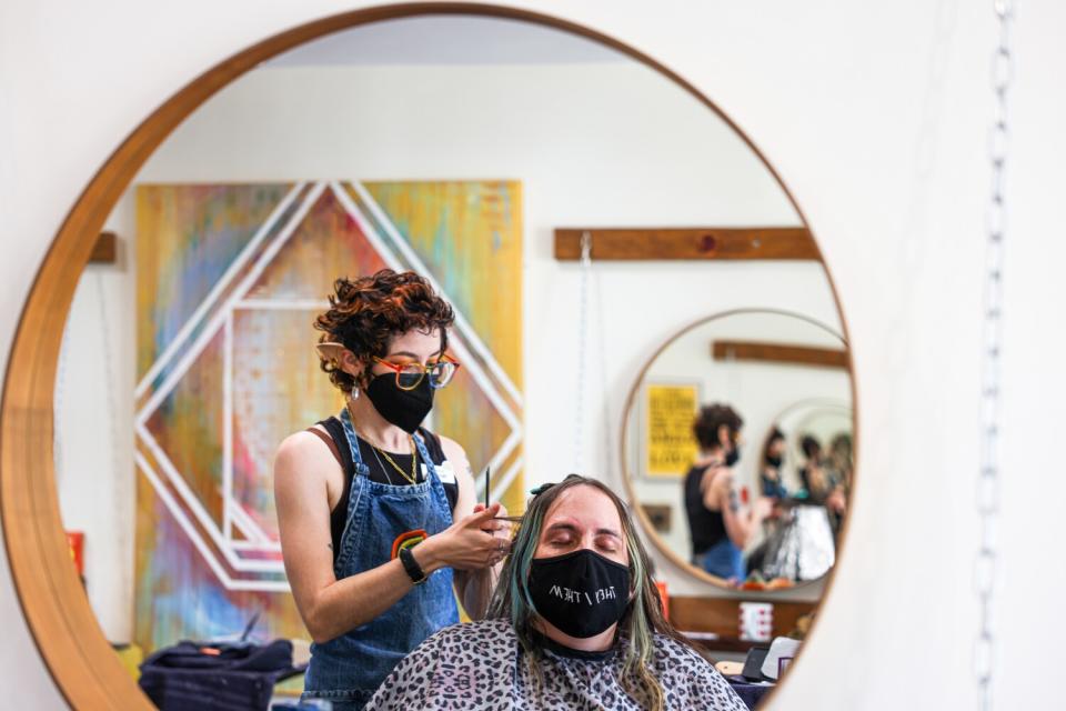 Rachel Fishbough, left, works on Dr. Kasa Niesner's hair at Salon Benders on Thursday, April 7, 2022 in Long Beach, CA.