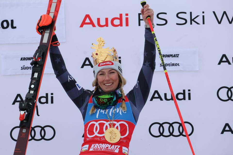 Mikaela Shiffrin celebrates on the podium after winning an alpine ski, women's World Cup giant slalom, in Kronplatz, Italy.