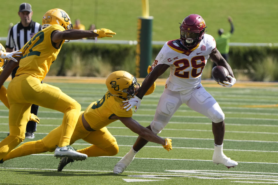 Iowa State running back Breece Hall (28) runs past Baylor safety Jalen Pitre (8) during the first half of an NCAA college football game, Saturday, Sept. 25, 2021, in Waco, Texas. (AP Photo/Jim Cowsert)