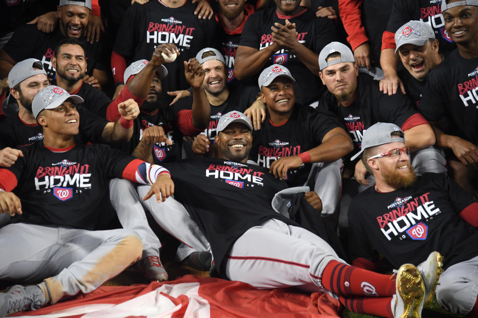 LOS ANGELES, CALIFORNIA - OCTOBER 09: Howie Kendrick #47 of the Washington Nationals celebrates with his tam after defeating the Los Angeles Dodgers 7-3 in ten innings to win game five and the National League Division Series at Dodger Stadium on October 09, 2019 in Los Angeles, California. (Photo by Harry How/Getty Images)