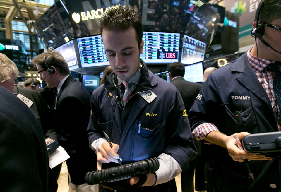 Trader Peter Cuttone works on the floor of the New York Stock Exchange Friday, April 4, 2014. Stocks are edging mostly higher in early trading Friday after the government reported that U.S. employers added to their payrolls last month. (AP Photo/Richard Drew)