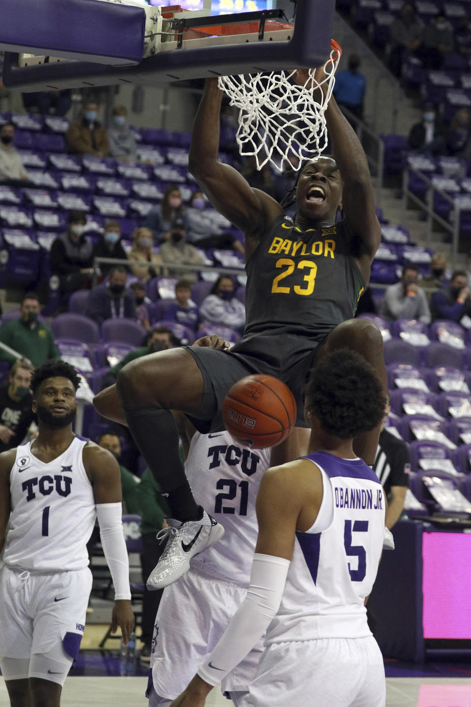 Baylor forward Jonathan Tchamwa Tchatchoua (23) dunks the ball against TCU in the second half of an NCAA college basketball game, Saturday, Jan. 9, 2021, in Fort Worth, Texas. (AP Photo/ Richard W. Rodriguez)