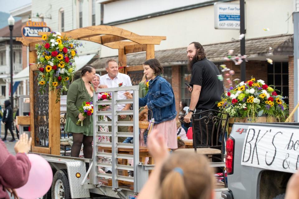 Debbie Ahrem and Ed Topczewski say their official “I Do’s” to become Mr. and Mrs. during the 2023 Canisteo Crazee Daze parade Thursday night in the village of Canisteo.