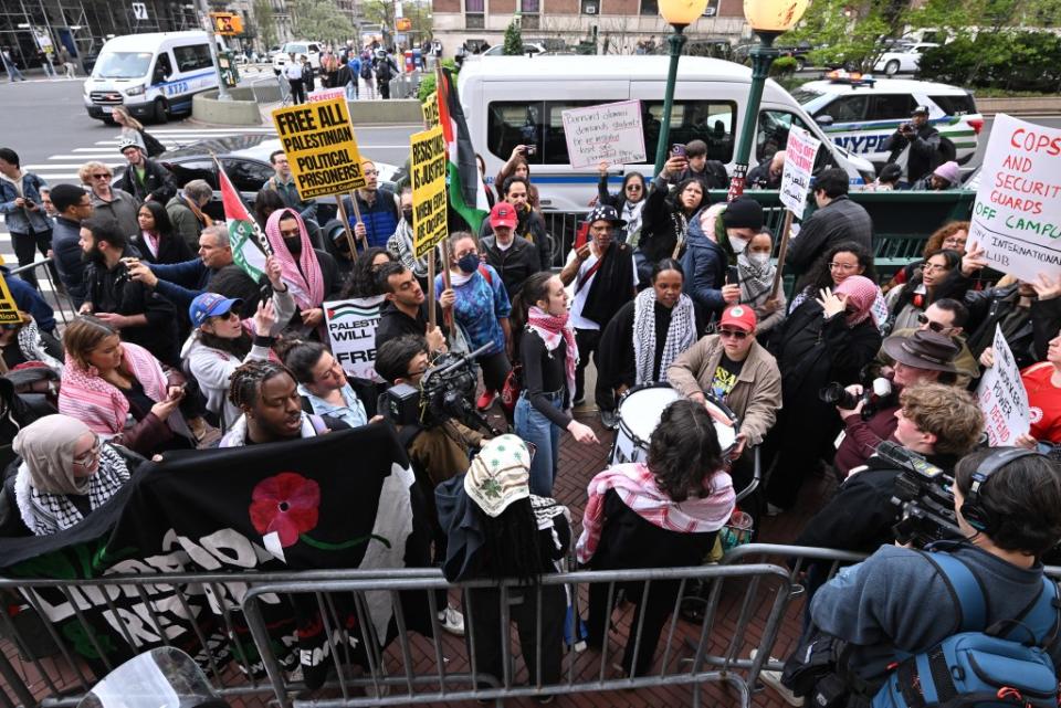 Protesters at Columbia University with signs and flags demanding the school divest from Israel. Paul Martinka