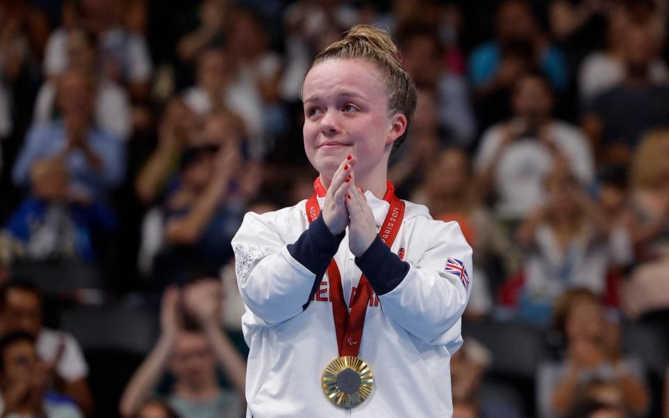 Maisie Summers-Newton collected her gold medal after winning the women's SM6 200m individual medley