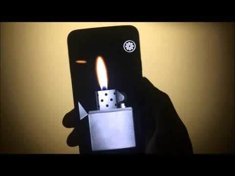 Screenshot of a hand holding an iPhone with a Zippo looking lighter lit on the screen