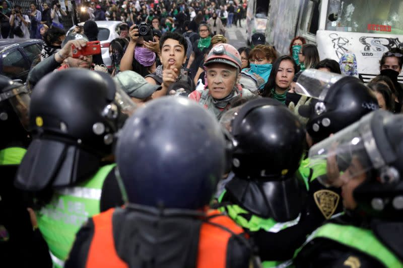 People take part in a protest against gender-based violence in downtown of Mexico City