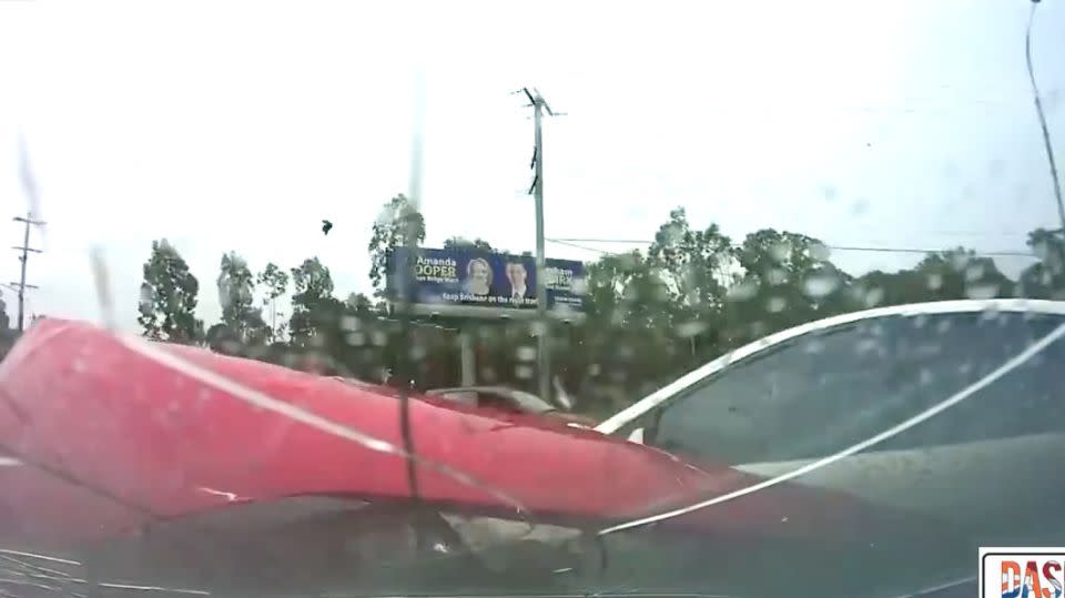 Chris' windscreen instantly cracks, and his bonnet can be seen crumpled from the impact of the collision. Photo: Dash Cam Owners Australia