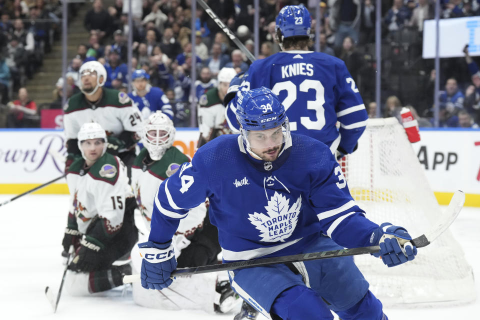 Toronto Maple Leafs' Auston Matthews (34) skates after scoring against the Arizona Coyotes during second-period NHL hockey game action in Toronto, Thursday, Feb. 29, 2024. (Chris Young/The Canadian Press via AP)