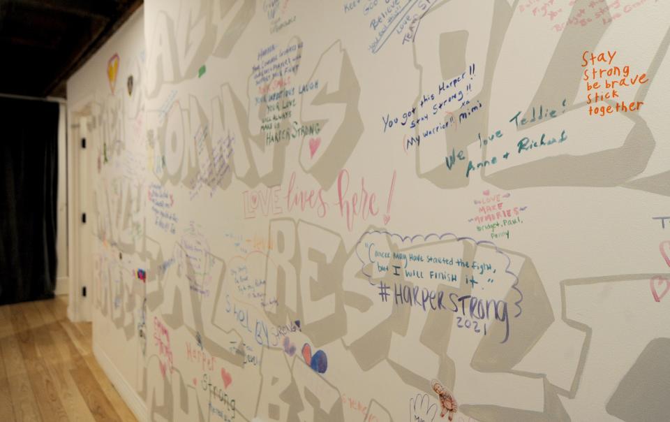 Messages from previous guests are written on the wall in the first-floor hallway.