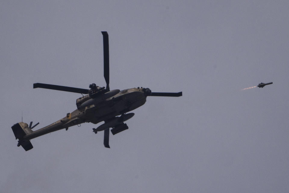 An Israeli Apache helicopter fires a missile towards the Gaza Strip, as seen from southern Israel, Tuesday, May 28, 2024. (AP Photo/Leo Correa)