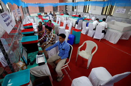 Election staff members work on their computers in a vote counting centre in Ahmedabad, India, May 22, 2019. REUTERS/Amit Dave