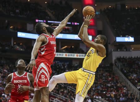 Nov 15, 2018; Houston, TX, USA; Golden State Warriors forward Kevin Durant (35) shoots the ball as Houston Rockets guard James Harden (13) defends during the third quarter at Toyota Center. Troy Taormina-USA TODAY Sports