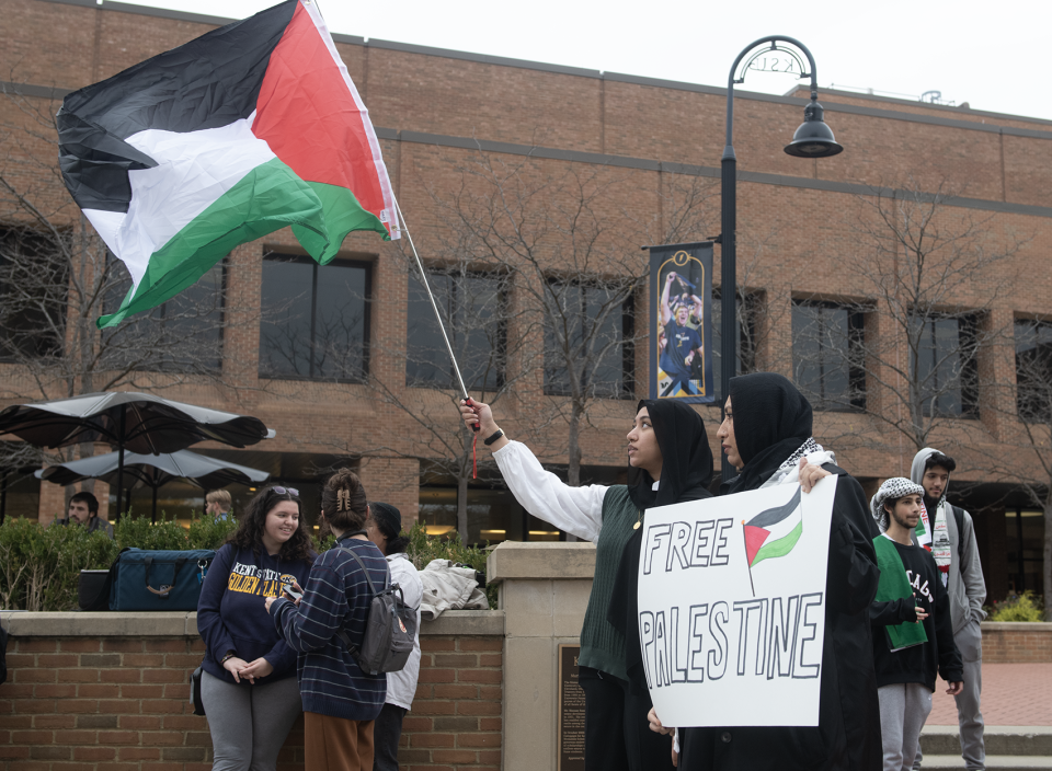 Isra Shaikh, 17, of Cleveland with parents from India, holds a Palestine flag and Sarah Khatoon, recent Kent State graduate with family from India, holds a Free Palestine sign.