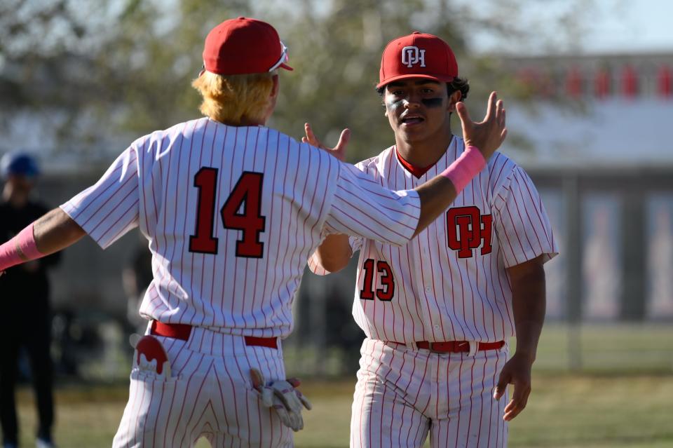 Oak Hill’s Paul Montoya celebrates with Patrick Dufer at the end of their victory against San Marino in Round 2 of CIF-Southern Section Division 4 playoffs on Tuesday, May 7, 2024 in Oak Hills. Oak Hills defeated San Marino 9-6 and will play Culver City in the Quarterfinals on Thursday, May 10.