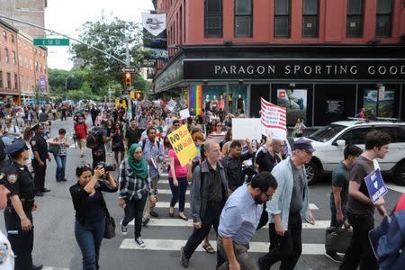 Protesters chant slogans against U.S. President Donald Trump's limited travel ban, approved by the U.S. Supreme Court, in New York City, U.S., June 29, 2017. REUTERS/Joe Penney