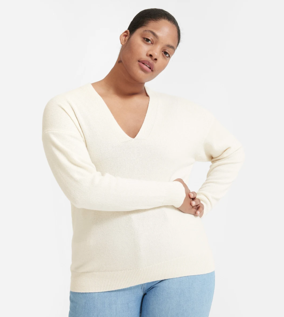 This sweater's deep, elongating neckline and generous length create a flattering fit. (Photo: Everlane)