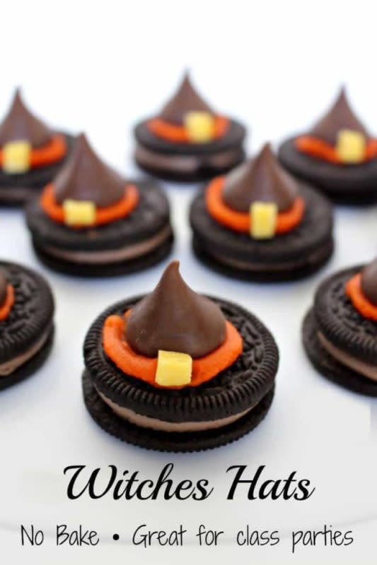 <p>This cute kid-friendly craft features fudge-covered peanut butter cookies, colored frosting, Hershey’s Kisses, and mini M&Ms to create a witchy crowned cookie.</p><p><strong>Get the recipe:</strong> <a href="https://princesspinkygirl.com/witch-hats-cookies/" rel="nofollow noopener" target="_blank" data-ylk="slk:Girl Halloween Witch Hat Cookies;elm:context_link;itc:0;sec:content-canvas" class="link ">Girl Halloween Witch Hat Cookies</a></p>