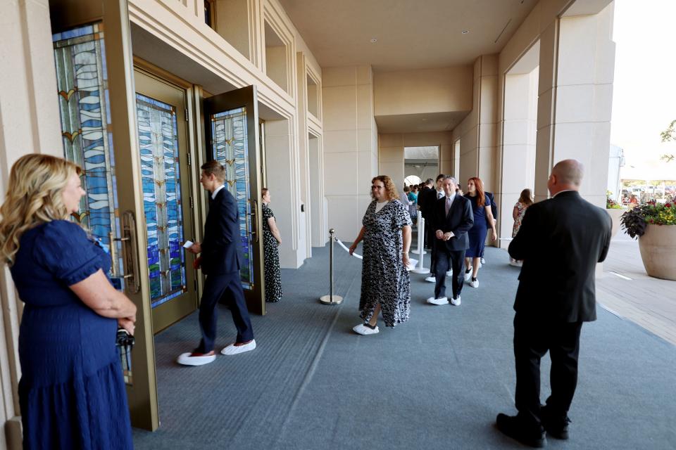 Attendees enter temple for the first of two sessions for the dedication of the Saratoga Springs Utah Temple in Saratoga Springs, Utah, on Sunday, Aug. 13, 2023. | Scott G Winterton, Deseret News