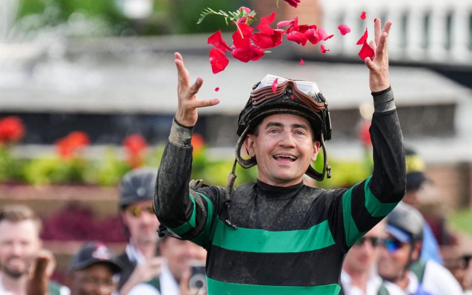 Jockey Brian J. Hernandez celebrates