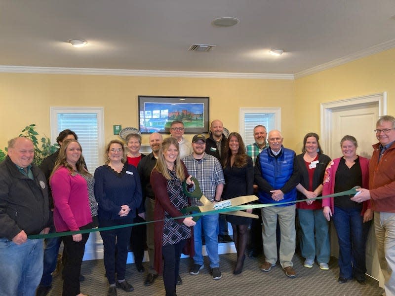 Employees from Blue Water Mortgage join GDCC staff, Ambassadors, Board members, and local officials for their ribbon-cutting ceremony at the Chamber.