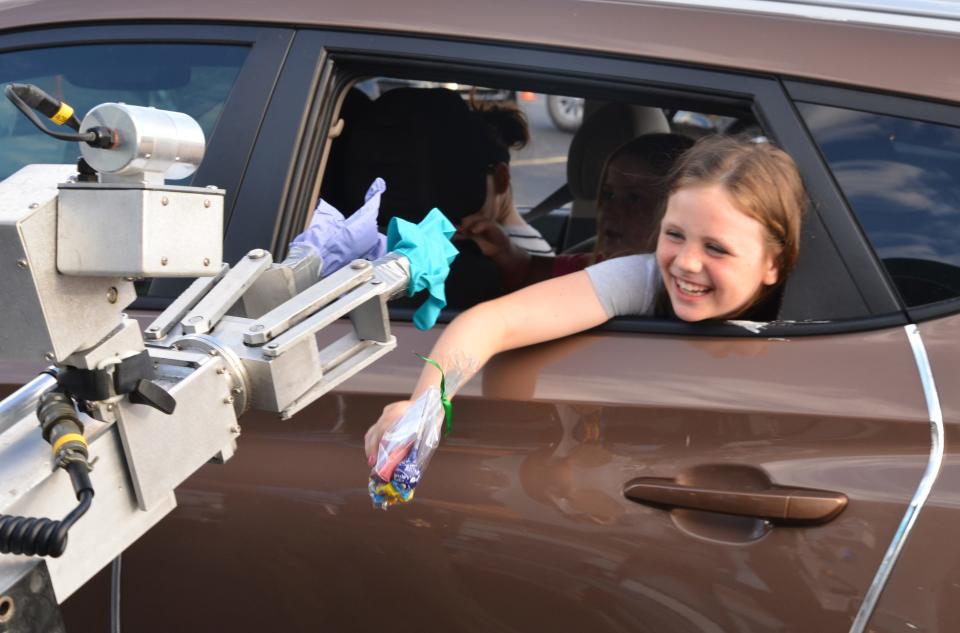 People going through the First Responders Drive-Thru Parade on March 25 saw several Brevard County Sheriff's Office displays, including a rubber-gloved bomb squad robot giving out candy to children at the end.