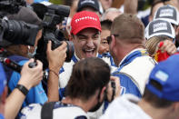 NTT IndyCar Series winner Alex Palou, center, celebrates with a team member after taking 4th place in an IndyCar auto race at Grand Prix of Long Beach, Sunday, Sept. 26, 2021, in Long Beach, Calif. (AP Photo/Alex Gallardo)