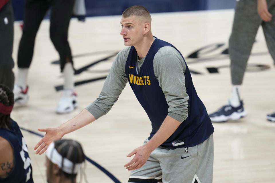 Denver Nuggets center Nikola Jokic calls for a ball as players take part in practice for Game 1 of the NBA basketball finals against the Miami Heat Wednesday, May 31, 2023, in Denver. (AP Photo/David Zalubowski)