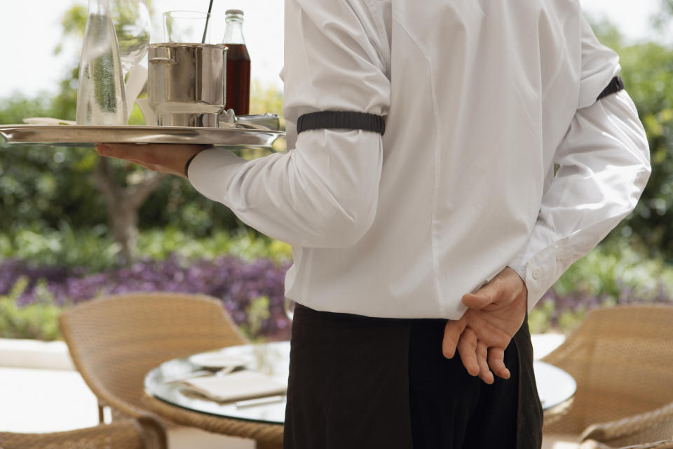 A waiter — like the one pictured here — received a crowdfunded tip.