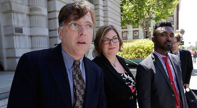 Lawyers speak outside court during the most recent proceedings over the photo in 2017. Source: AAP