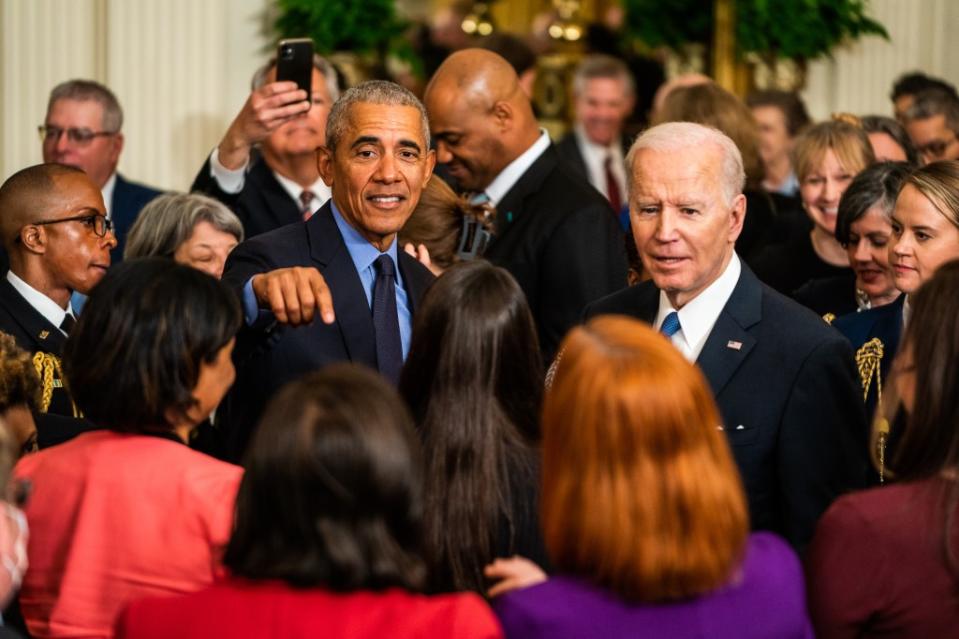 President Joe Biden and Former President Barack Obama greet visitors in the East Room of The White House following remarks on the Affordable Care Act on Tuesday, April 5, 2022. (Photo by Demetrius Freeman/The Washington Post via Getty Images)