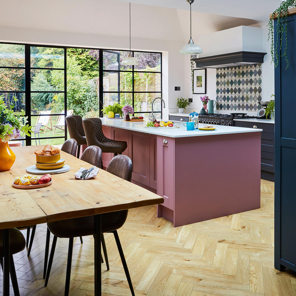 Kitchen extension with red island and crittall doors