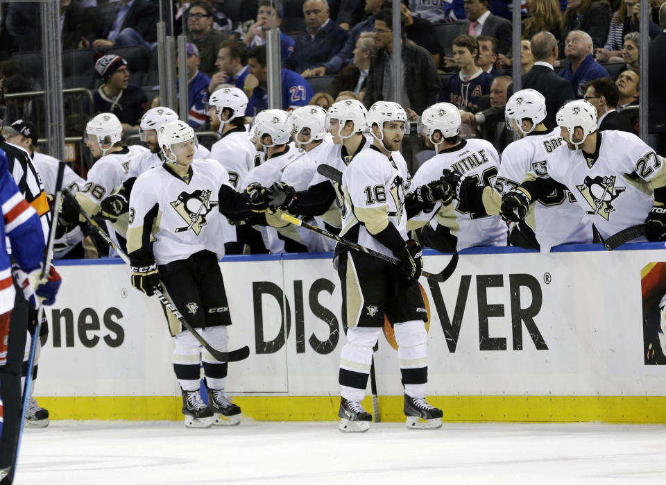 Pittsburgh Penguins' Brandon Sutter (16) celebrates a goal with teammates during the second period of a second-round NHL Stanley Cup hockey playoff series against the New York Rangers, Wednesday, May 7, 2014, in New York. (AP Photo/Frank Franklin II)