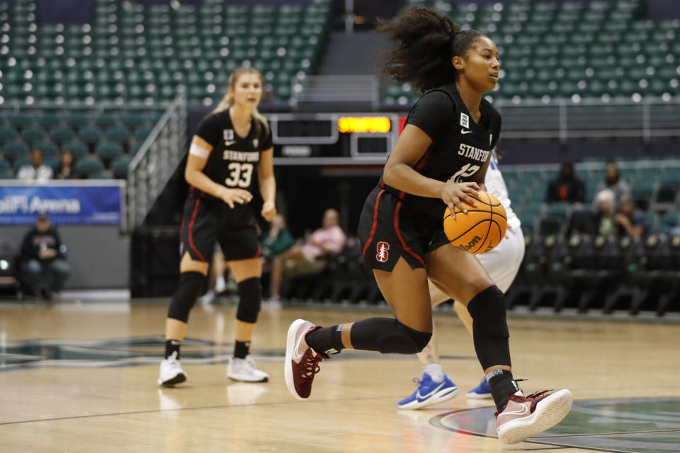 Stanford guard Indya Nivar (12) runs to the net against Florida Gulf Coast during the first quarter of an NCAA college basketball game, Friday, Nov. 25, 2022, in Honolulu. (AP Photo/Marco Garcia)