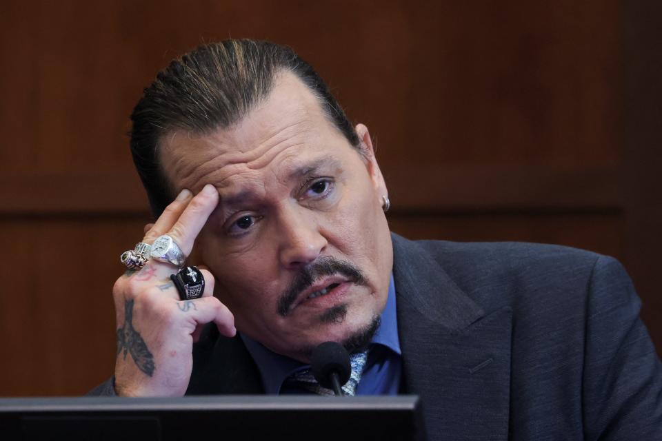 Johnny Depp testifies in the courtroom during his defamation trial against his ex-wife Amber Heard, at the Fairfax County Circuit Courthouse in Fairfax, Virginia, U.S., May 25, 2022.