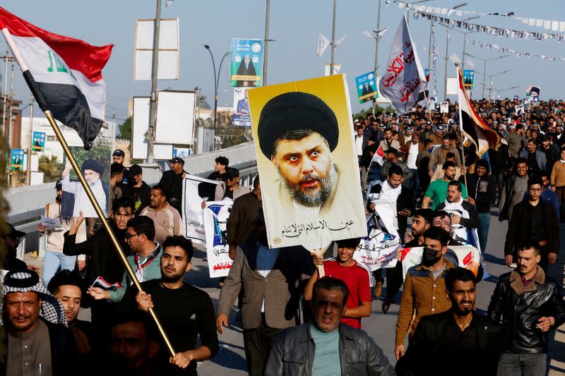 FILE PHOTO: Supporters of Iraqi Shi'ite cleric Moqtada al-Sadr demonstrate after he called on his supporters to boycott the upcoming local elections, in Najaf