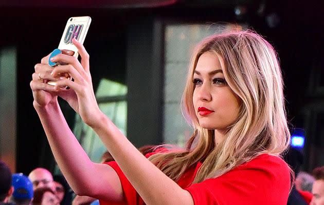 Gigi Hadid taking a selfie. Photo: Getty Images