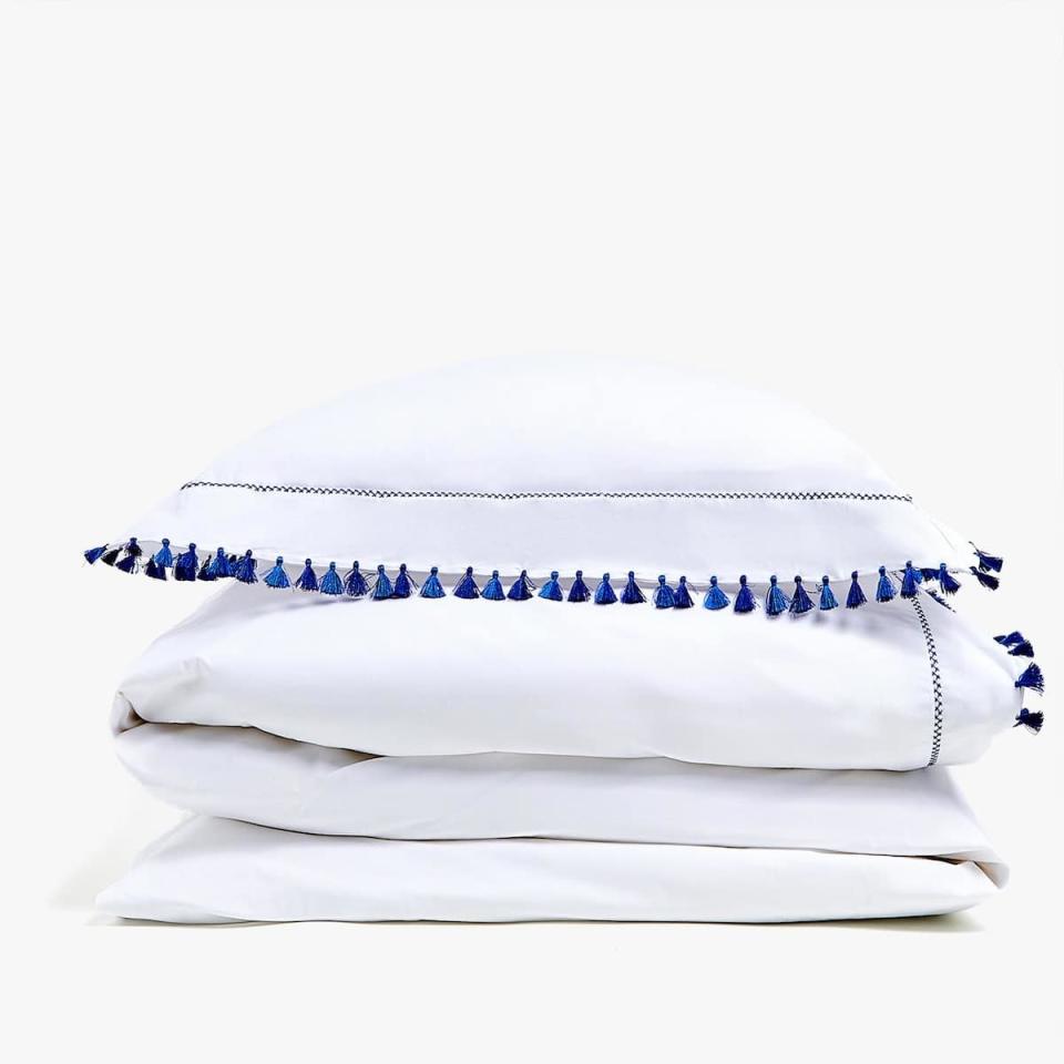 <p>This tasseled duvet set adds a bit of fun without going over the top with print or pattern (AKA it'll match basically everything). It also comes in red.</p> <p><strong>Shop It Here:</strong> Blue tassel duvet cover, $69.90-$99.90, <a rel="nofollow noopener" href="https://www.zarahome.com/us/bedroom/duvet-covers/blue-tassel-duvet-cover-c1020117135p300477614.html?colorId=400&parentId=300482128" target="_blank" data-ylk="slk:zarahome.com;elm:context_link;itc:0;sec:content-canvas" class="link ">zarahome.com</a></p>