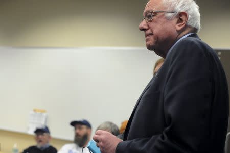 U.S. Democratic presidential candidate Bernie Sanders listens as he is introduced at a campaign event at Wartburg College in Waverly, Iowa January 30, 2016. REUTERS/Mark Kauzlarich