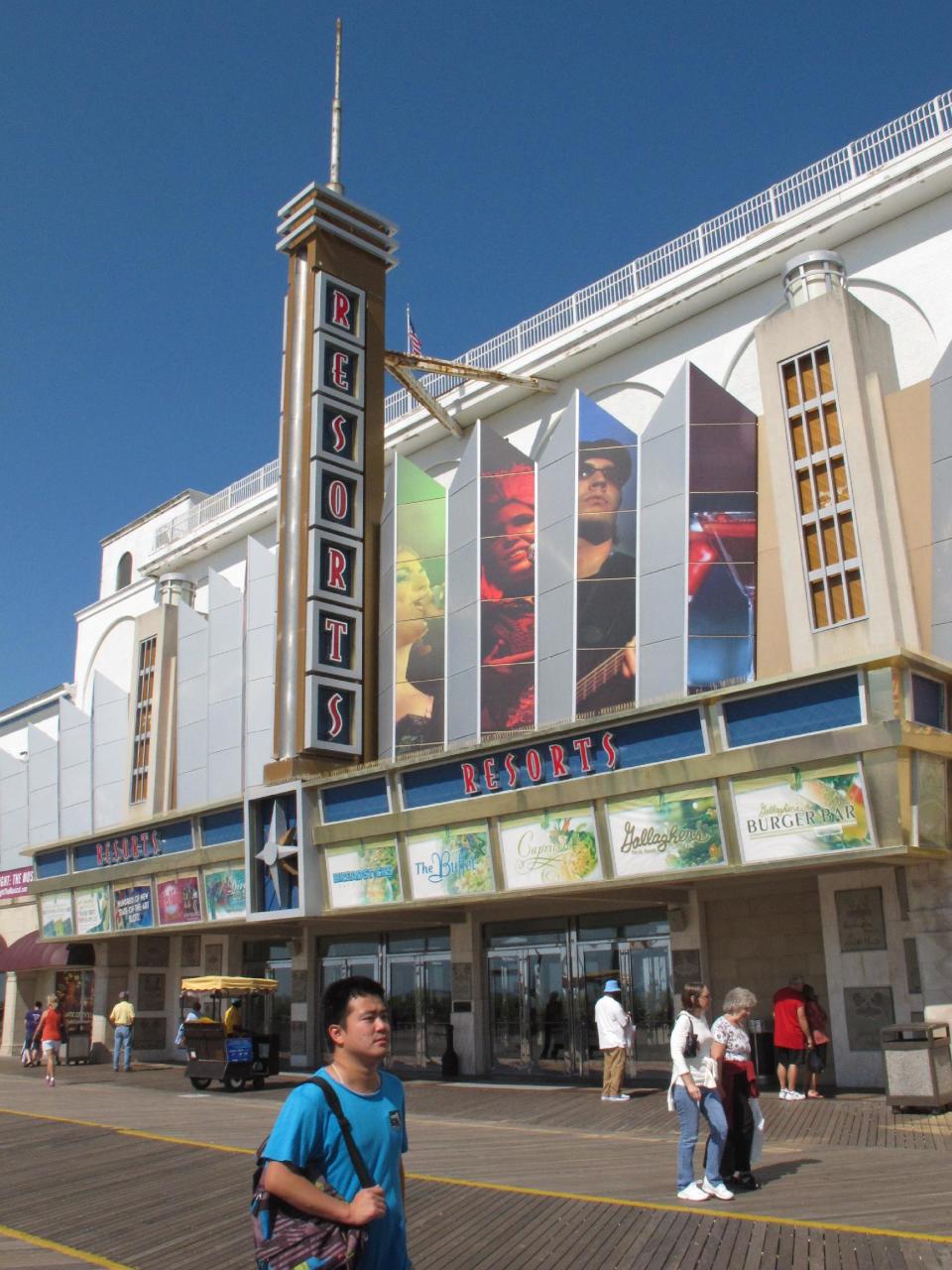 In a Sept. 14, 2012 photo pedestrians pass a casino on the Atlantic City, N.J. Boardwalk. A poll released Sept. 24, 2012 finds most New Jerseyans oppose expanding casino gambling outside of Atlantic City, and also oppose state tax breaks for casino companies. (AP Photo/Wayne Parry)