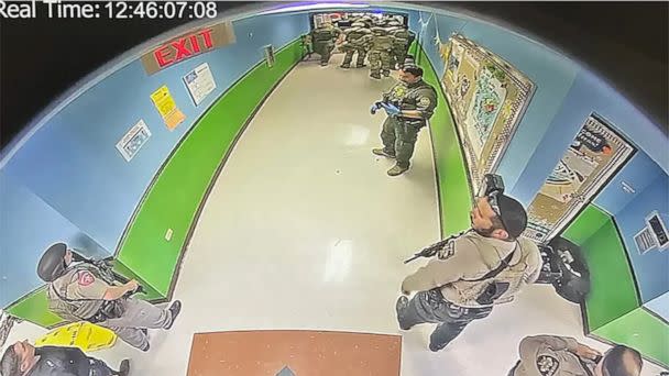 PHOTO: A CCTV image from inside Robb Elementary school, first obtained by The New York Times, shows officers in the hallway of the school in Uvalde, Texas, at 12:46 pm on May 24, 2022, according to the visible timestamp. (Obtained by The New York Times)