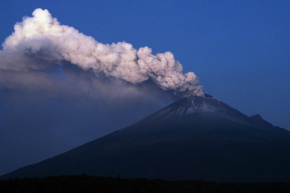 The Popocatepetl volcano erupts lava, ash and steam, seen from from Santiago Xalitzintla, Mexico, early Thursday, May 25, 2023. (AP Photo/Marco Ugarte)