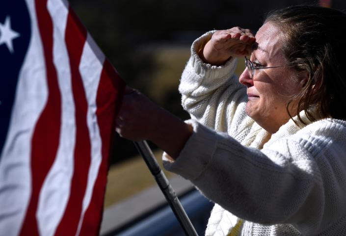 Ronald Erdrich's photo of a woman holding a U.S. flag and saluting to honor fallen Eastland County Sheriff Deputy Barbara Fenley was part of his winning Star Photojournalist of the Year package.