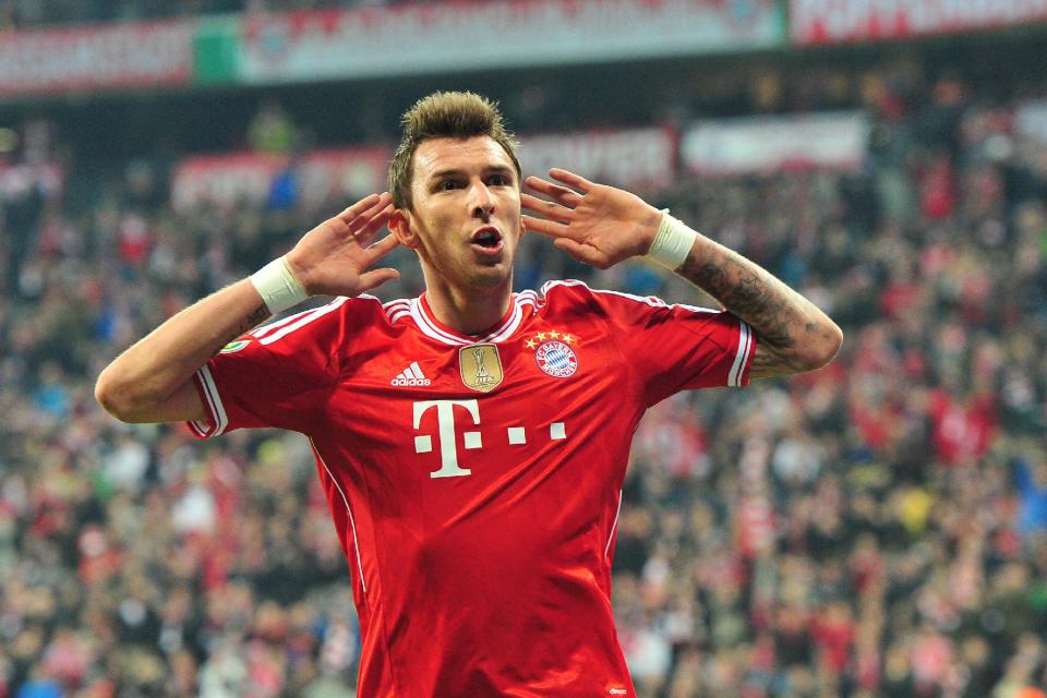 Munich's Mario Mandzukic of Croatia celebrates after scoring during the German soccer cup (DFB Pokal) semifinal soccer match between FC Bayern Munich and FC Kaiserslautern in the Allianz Arena in Munich, Germany, on Wednesday, April 16. 2014. (AP Photo/Kerstin Joensson)