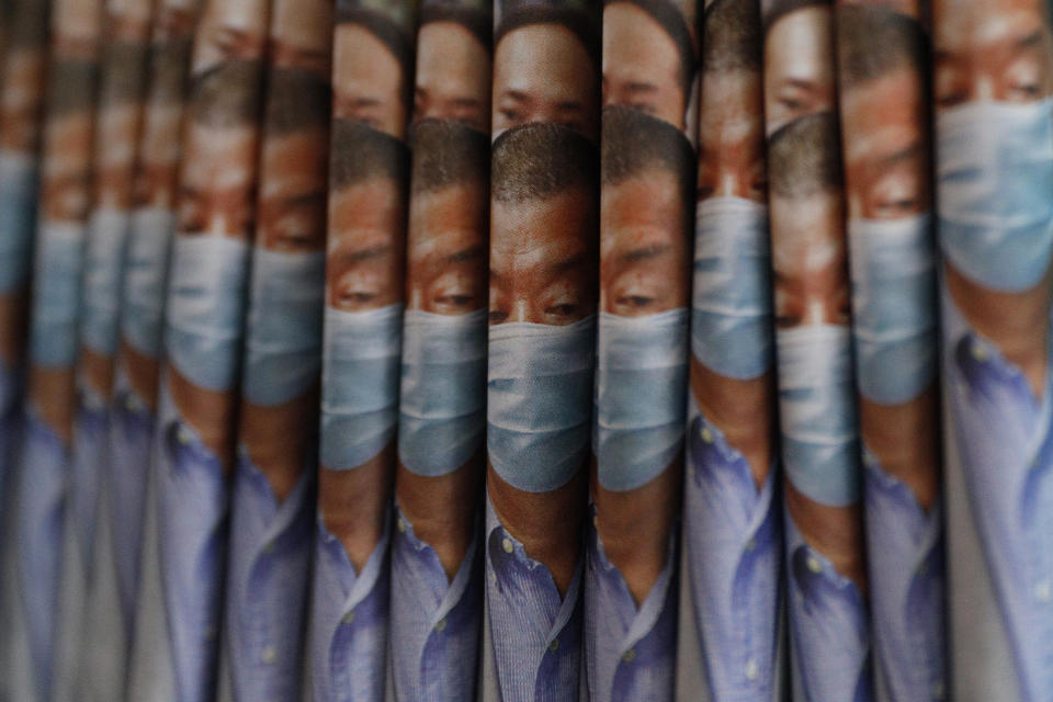 Copies of Apple Daily newspaper with front pages featuring Hong Kong media tycoon Jimmy Lai, are displayed for sale at a newsstand in Hong Kong, Tuesday, Aug. 11, 2020. Hong Kong police have arrested Lai and raided the publisher's headquarters, broadening their enforcement of a new security law and raising fears about press freedom in the semi-autonomous Chinese city. (AP Photo/Kin Cheung)