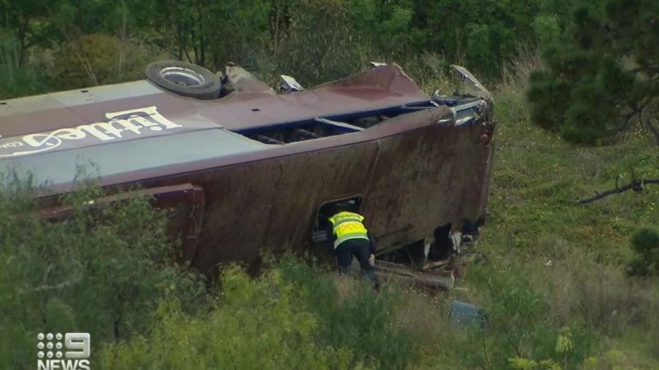 Prosecutors allege three people were ejected from the bus as it rolled down the embankment. Picture: Nine News