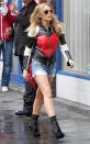 Every once in a while, I'm going to feature a fun, casual look in 2 Hot 2 Handle. This week, I'm all about the outfit Kylie Minogue wore while shooting her new music video in London. The pint-size diva perfectly paired a leather, heart-stitched Moschino jacket with D&G short shorts, black booties, and aviators. Can a 43-year-old pull this look off? I say, "YES!" (4/19/2012)